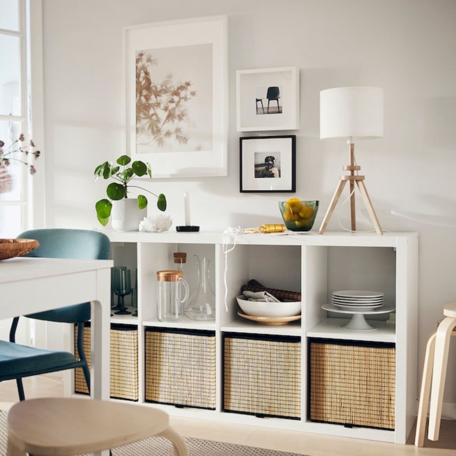White cube shelving units with basket inserts and decorative items in dining room