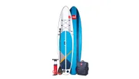 Red Paddle Co 11'0 Compact in white and blue, next to pump, oar and carry bag