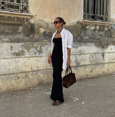 @hannamw wearing white button down, black dress, and mesh flats