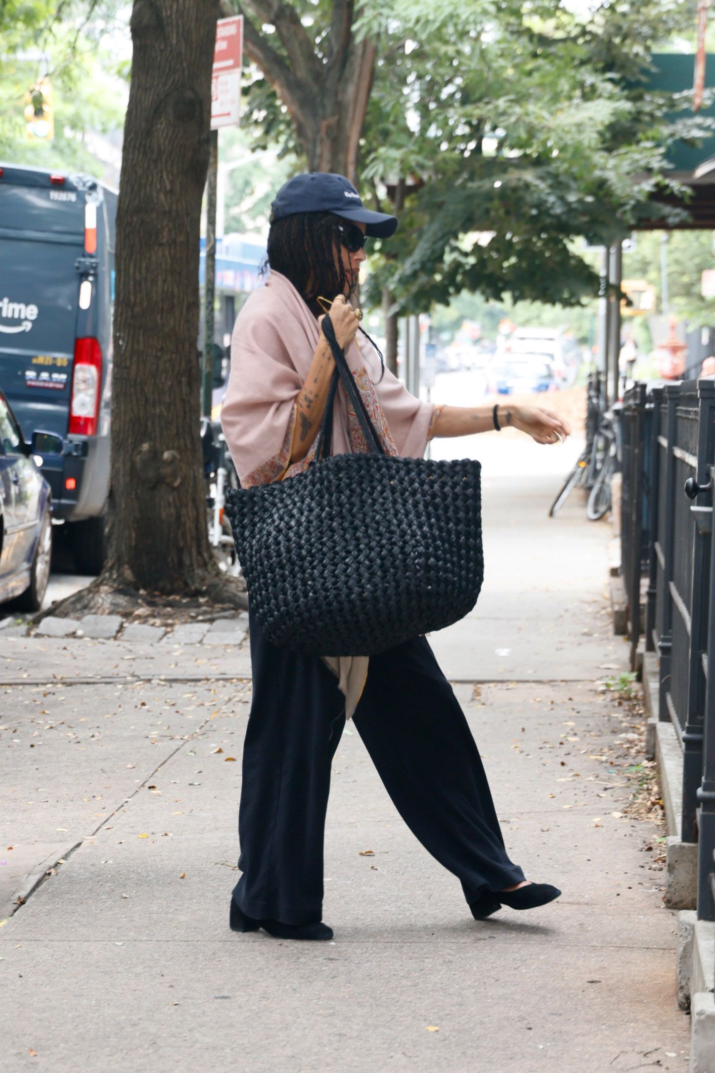 Zoe Kravitz sports a black Estelle Two Bag as she returns home to Williamsburg Brooklyn from the Airport.