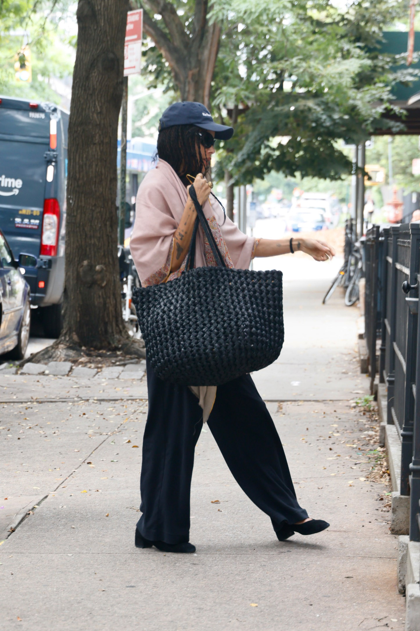 Zoe Kravitz sports a black Estelle Two Bag as she returns home to Williamsburg Brooklyn from the Airport.