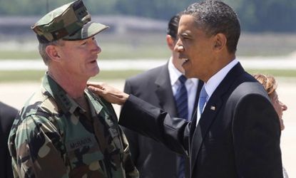 President Obama talks with U.S. Navy Vice Admiral William H. McRaven, who led the NAVY SEALs' Team Six, just days after Osama bin Laden was killed last year.