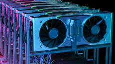 A close-up shot of a rack containing GPUs, lit in blue and purple lighting.