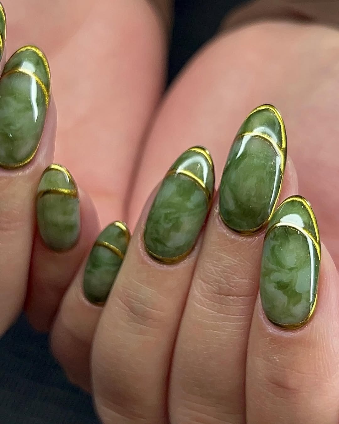 Jade green nails.