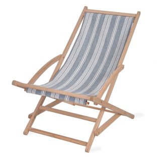 A traditional wooden folding deckchair with blue and white striped upholstery.