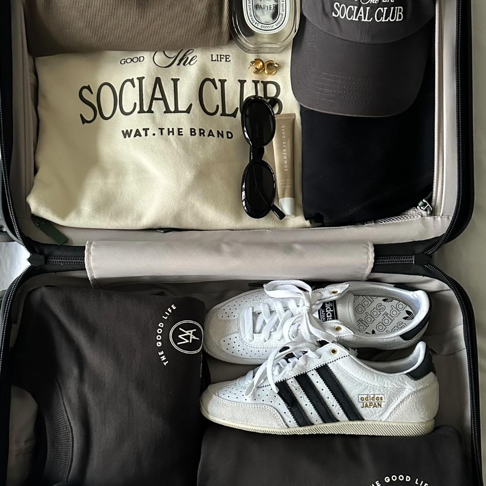 Adidas Japan trainers packed in a suitcase.