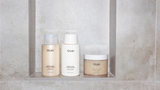 OUAI shampoo and hair mask in a shower