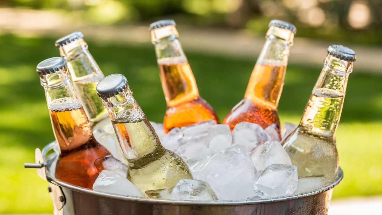 Drinks bottles in a metal bucket with ice