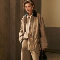 Model wearing a neutral COS suit 