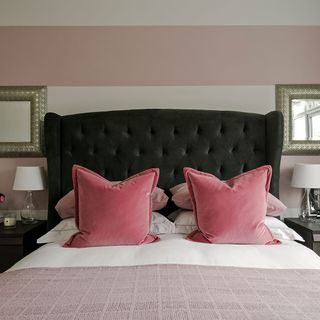 bedroom with pink cushions and lamps