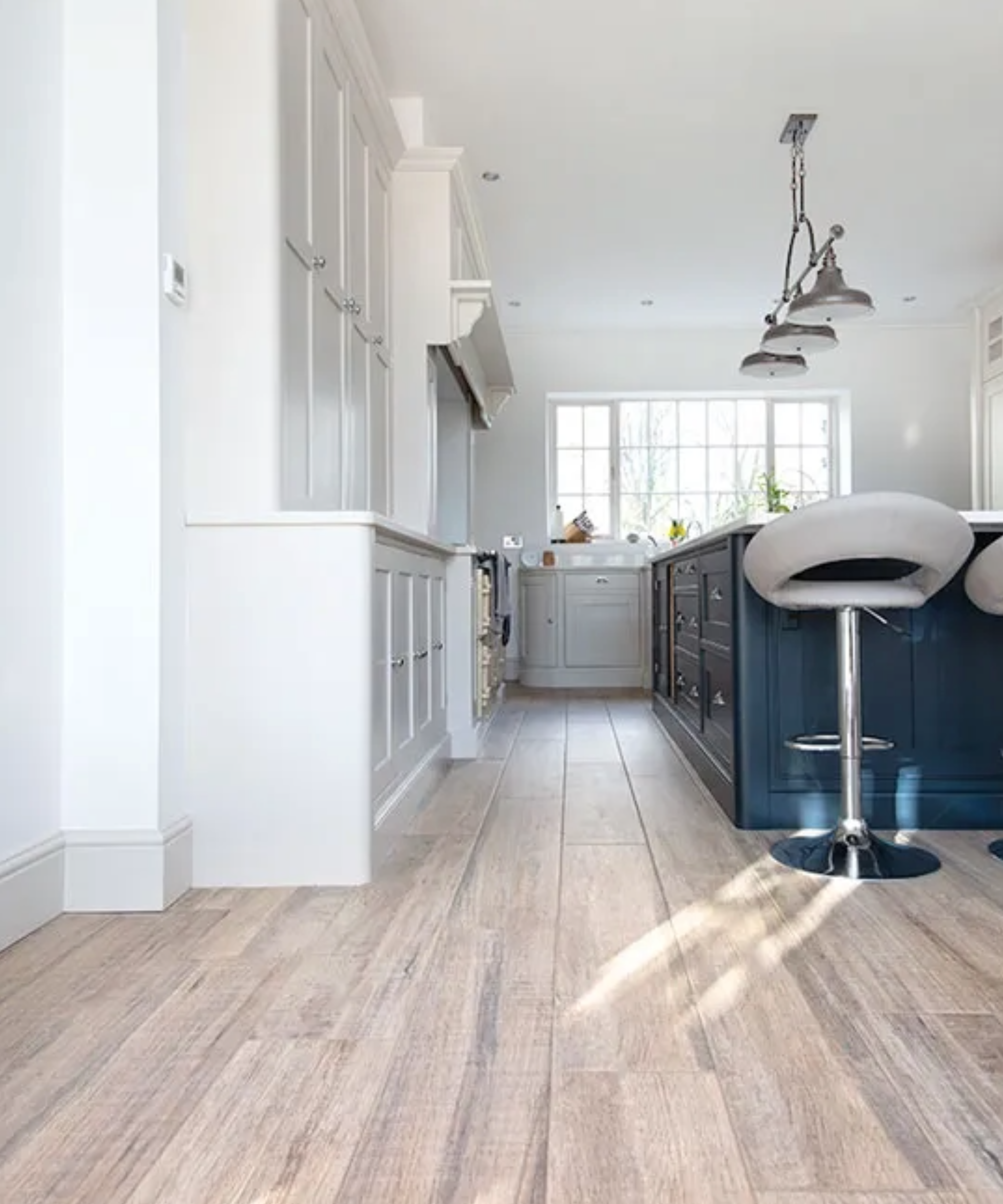 a kitchen flooring idea with wood effect porcelain tiles