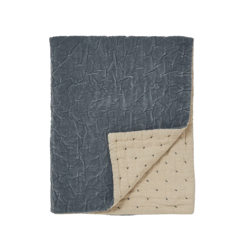 A blue velvet quilt