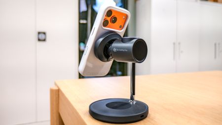 LISEN 3-in-1 Qi2.2 MagSafe Charging Stand with Cooling Fan with an iPhone connected to it.