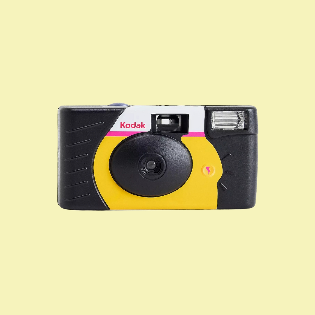 Kodak Power Flash Disposable Camera on a pale yellow background.