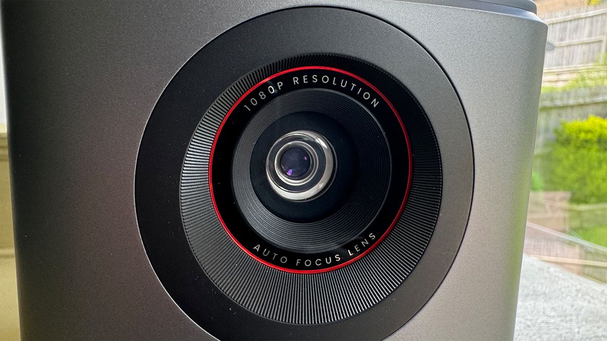 A close-up of the lens on an Anker Nebula Mars 3 Air portable projector.