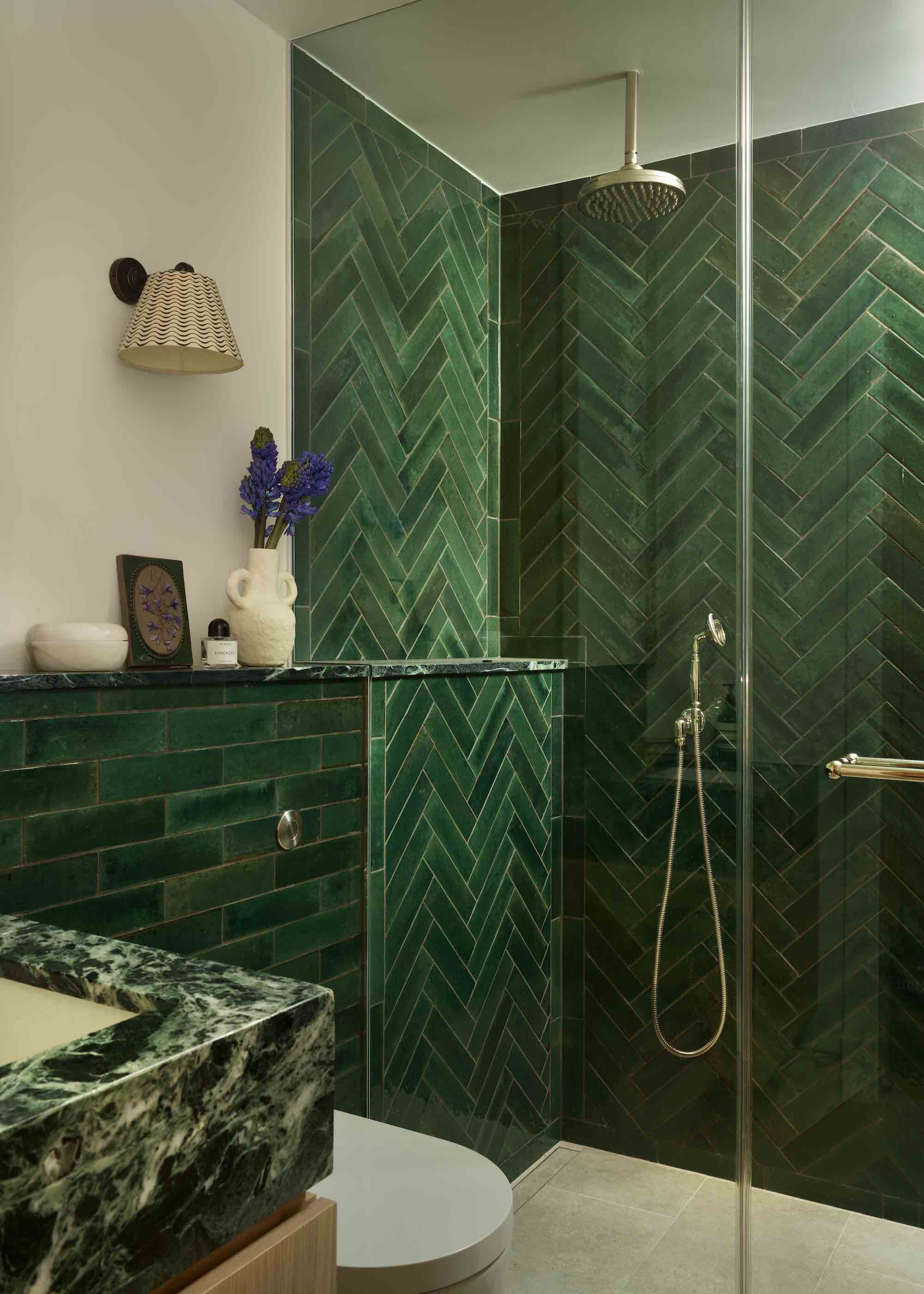 small ensuite bathroom with emerald green tiles