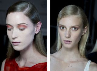 Models with light make-up and slicked back hair