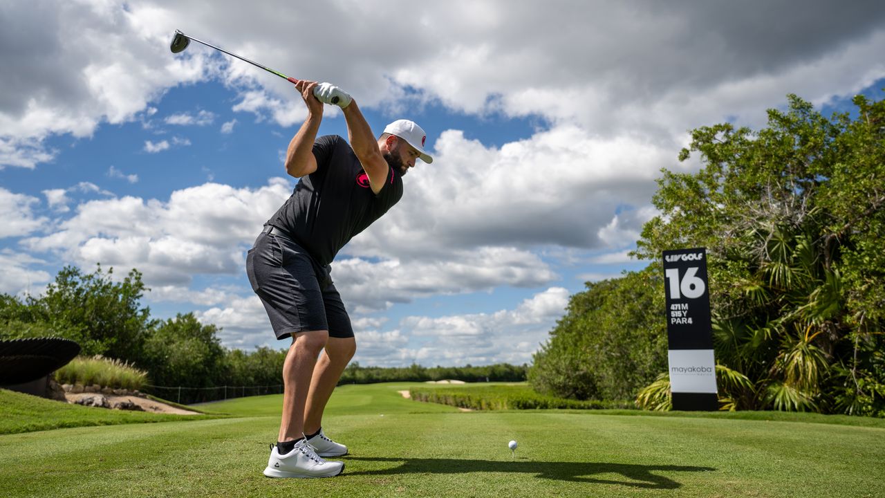 Jon Rahm at the top of his backswing about to hit a drive