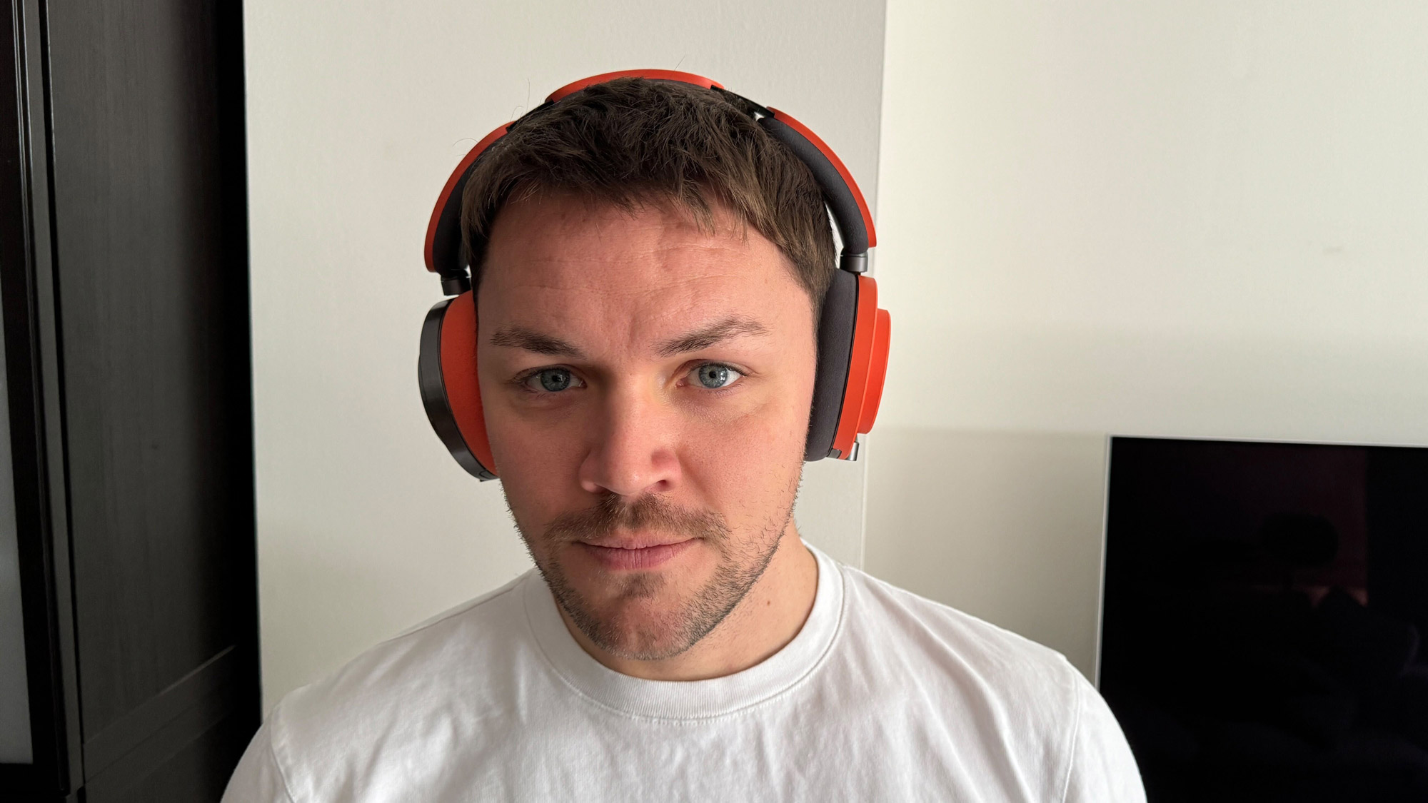 The Dyson OnTrac headphones viewed when worn on the head, from the front and side