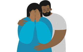 Woman being comforted by her partner