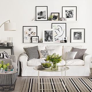 living room with off white wall and free and easy format photo frame