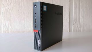A Lenovo ThinkCentre Tiny in a vertical position