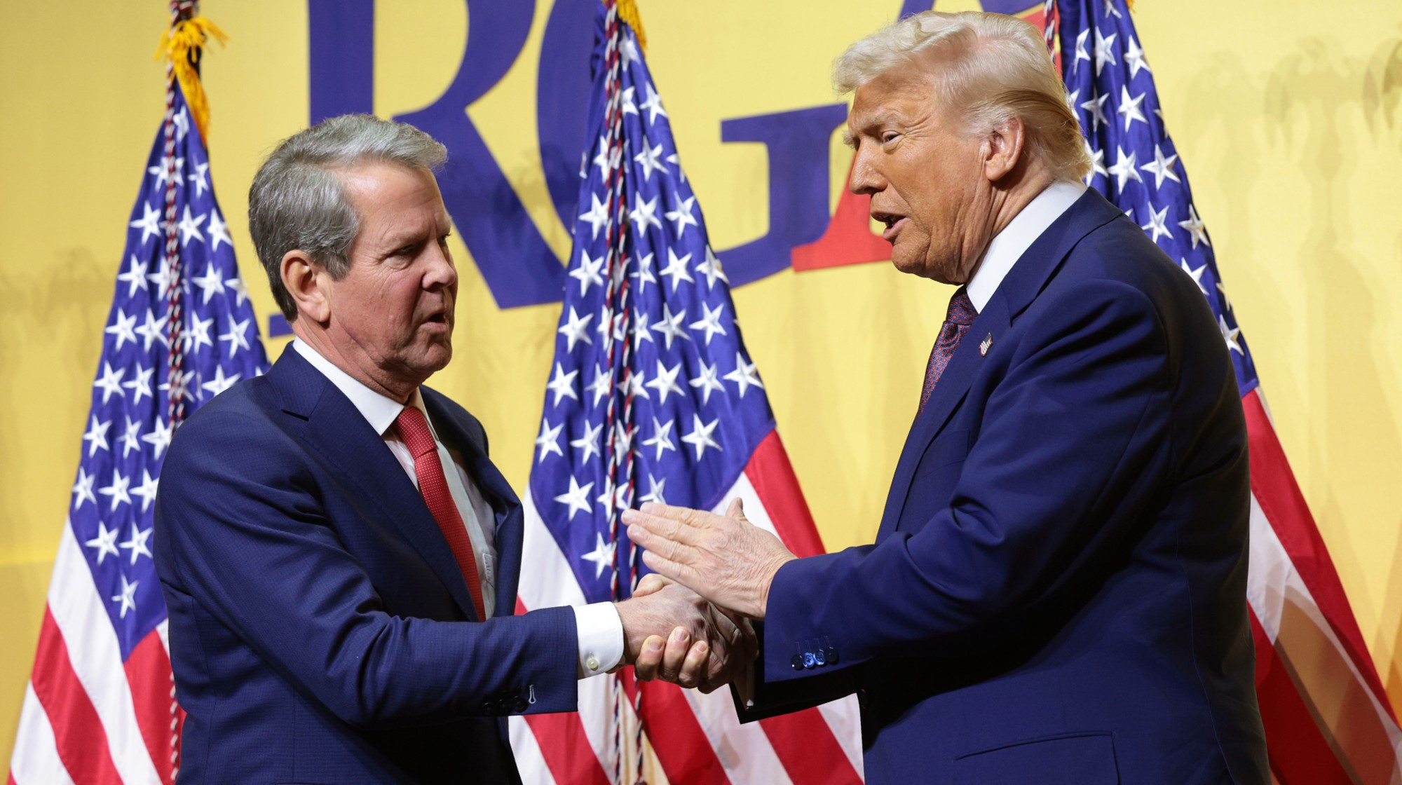WASHINGTON, DC - FEBRUARY 20: U.S. President Donald Trump shakes hands with Gov. Brian Kemp (R-GA) as he delivers remarks at the Republican Governors Association Meeting at The National Building Museum on February 20, 2025 in Washington, DC. Trump discussed his legislative agenda in his remarks. (Photo by Win McNamee/Getty Images)