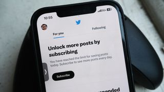 A message in the Twitter app says you need to subscribe to Twitter Blue to see more posts