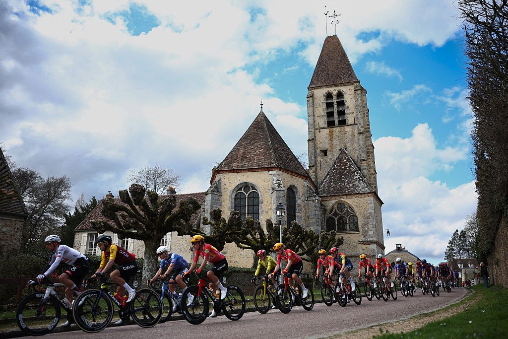 The pack rides during the 2nd stage of the Paris-Nice cycling race, 187 km between &amp;Eacute;p&amp;ocirc;ne and Montargis, on March 9, 2026. (Photo by Anne-Christine POUJOULAT / AFP)
