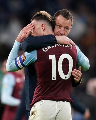 Jack Grealish is consoled by assistant manager John Terry