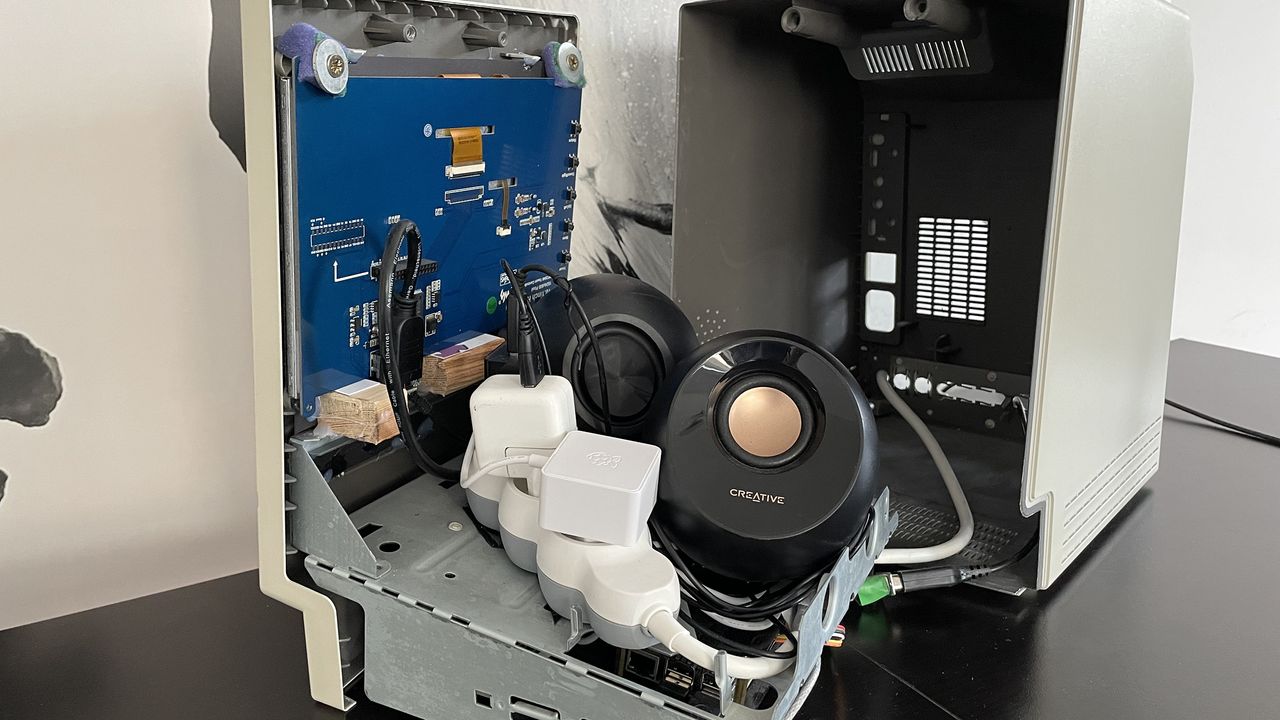 The MacintoshPi case open showing the speaker and rear view of the screen
