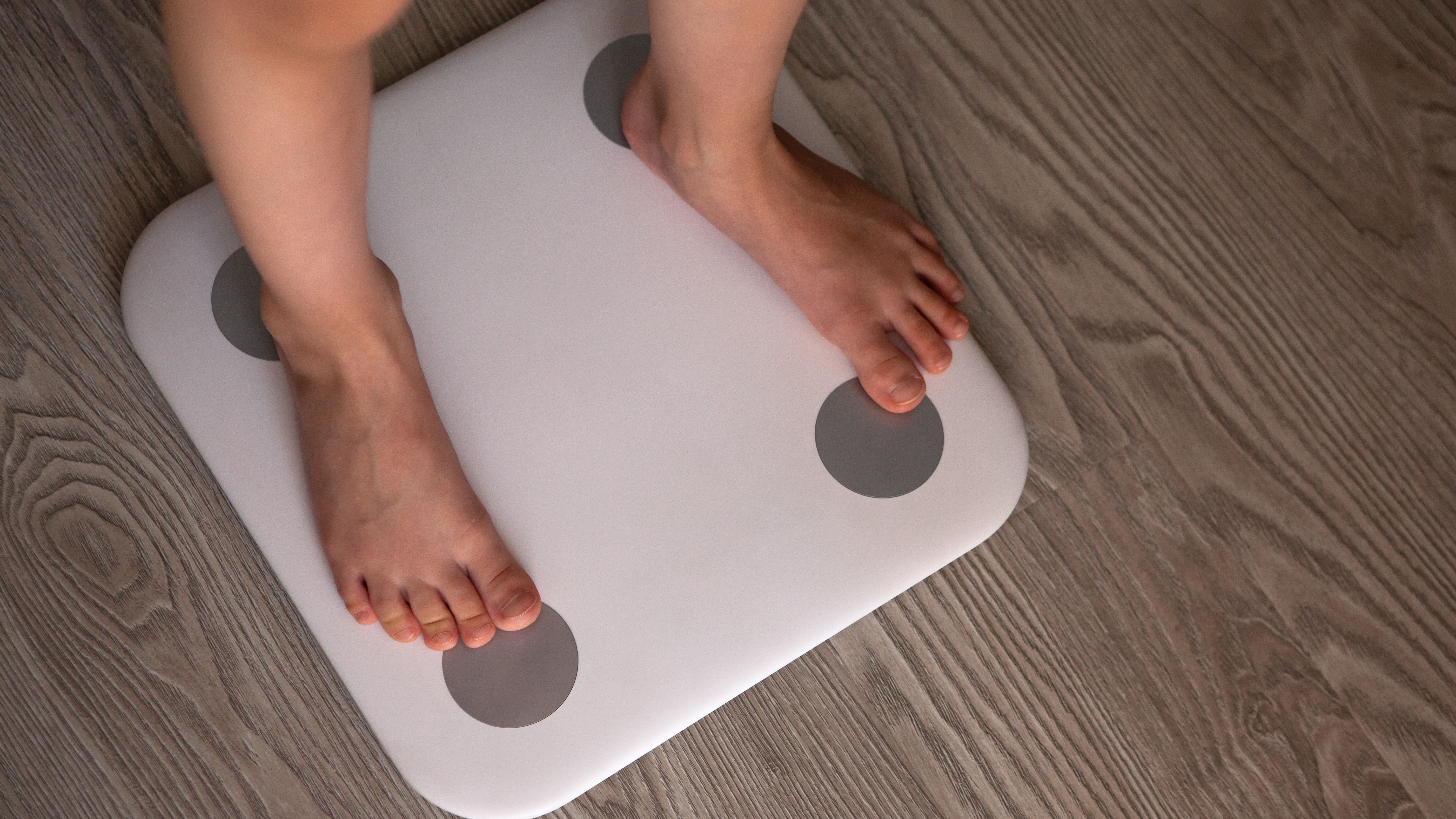 Person standing on smart scales