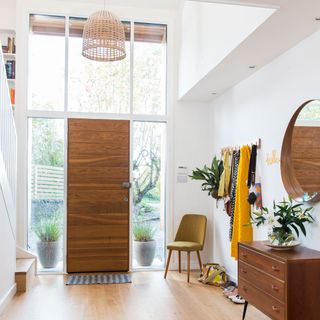 exterior of scandi house hallway with ladderax chest and round mirror