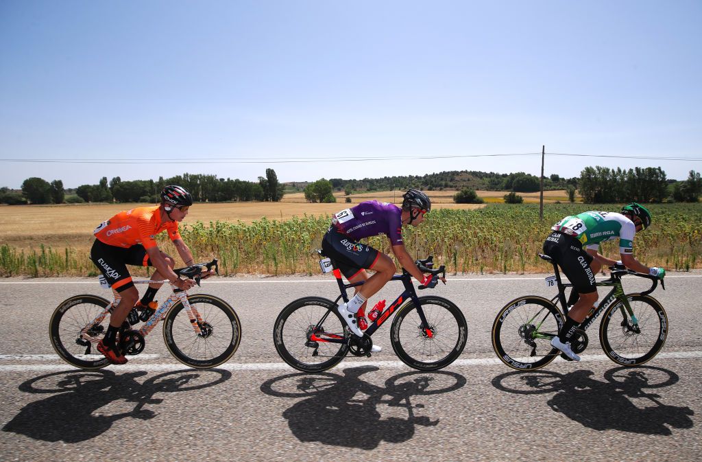 BURGOS SPAIN AUGUST 15 LR Xavier Mikel Azparren Irurzun of Spain and Team Euskaltel Euskadi Sergio Roman Martin Galan of Spain and Team Caja RuralSeguros RGA and Diego Rubio Hernandez of Spain and Team Burgos BH in breakaway during the 76th Tour of Spain 2021 Stage 2 a 1667km stage from Caleruega Monasterio de Santo Domingo de Guzmn to Burgos Gamonal lavuelta LaVuelta21 CapitalMundialdelCiclismo on August 15 2021 in Burgos Spain Photo by Gonzalo Arroyo MorenoGetty Images