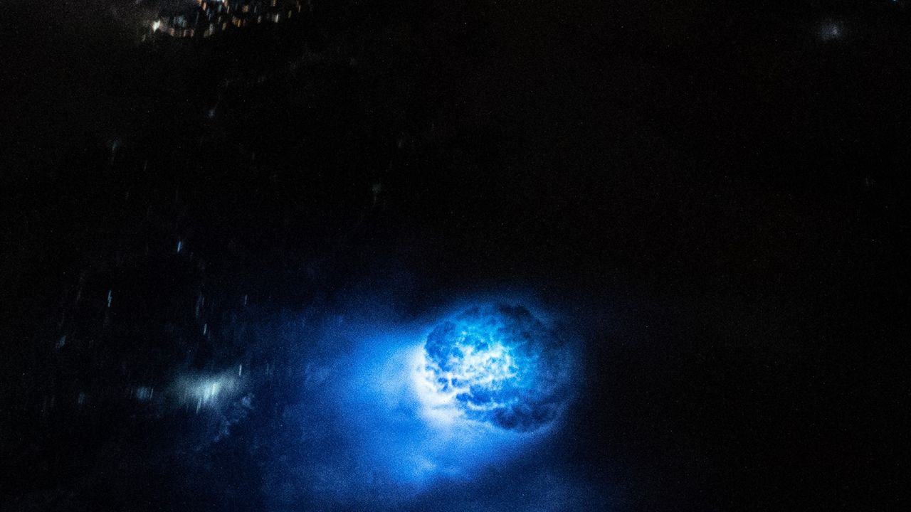 The first blue blob was the result of a lightning strike illuminating a large bowl of uncovered cloud in the Gulf of Thailand.