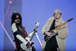 Nikki Sixx and John 5 performing live with Motley Crue