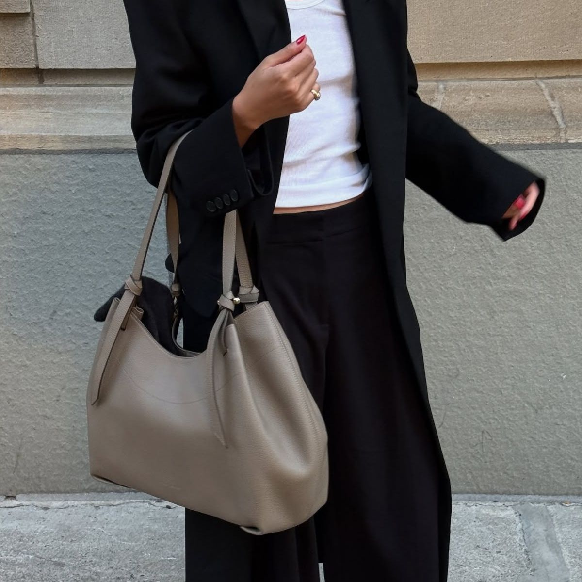 Mimi wearing the Strathberry tote bag