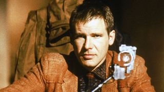 Harrison Ford sits in a lavish office in Blade Runner