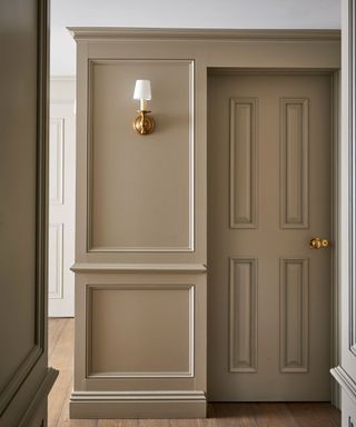 neutral landing with wall panelling and wall light