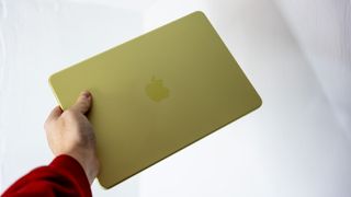 Apple MacBook Neo in Citrus colour.