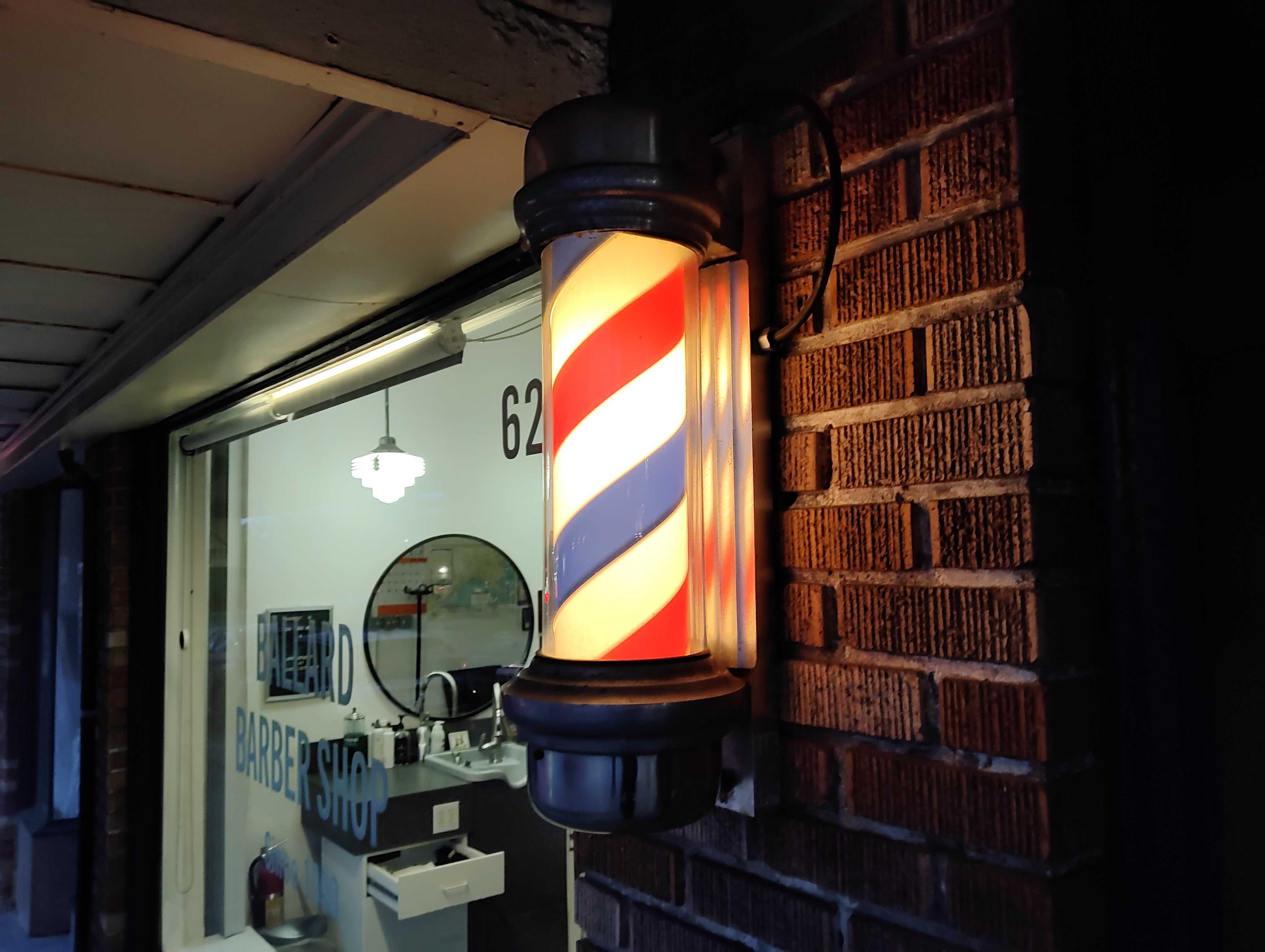 A barbershop pole night at night