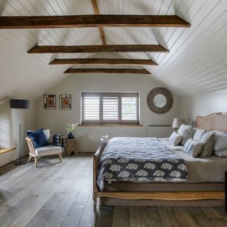 cornish dream home master bedroom with exposed beams