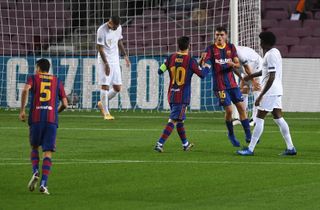 Pedri celebrates with Lionel Messi after scoring for Barcelona against Ferencvaros in the Champions League in October 2020.