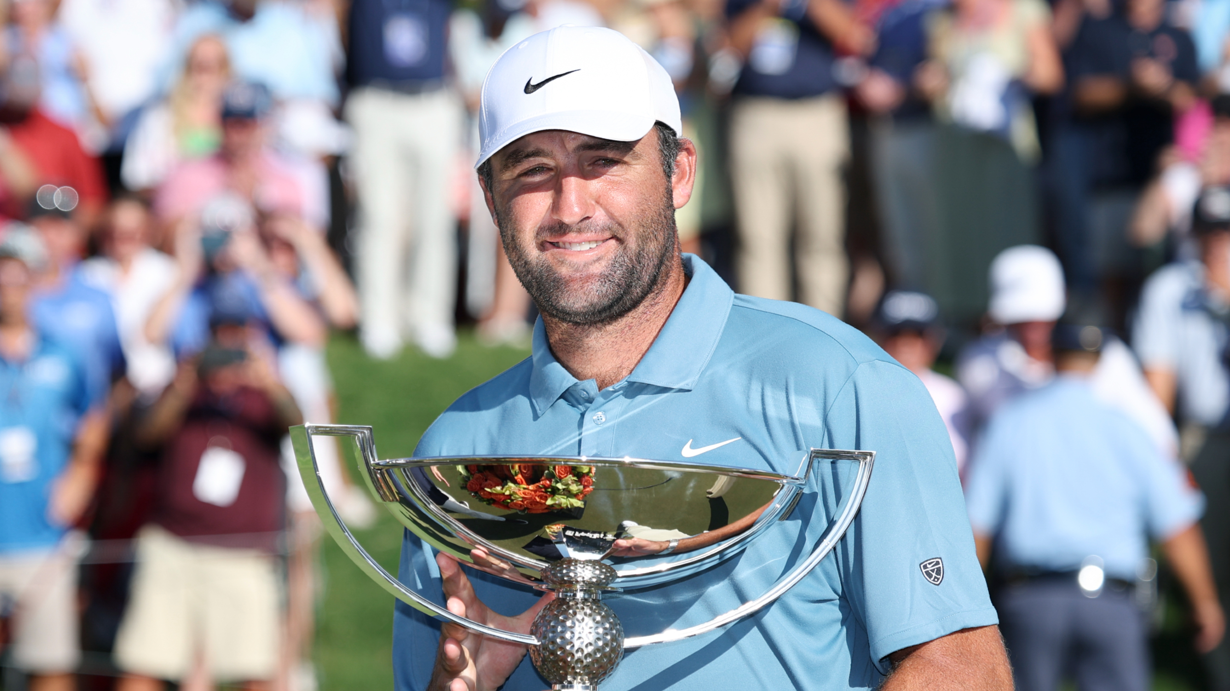 Scottie Scheffler with the FedExCup trophy