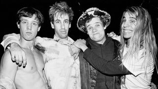 Portrait of the members of American Rock group Red Hot Chili Peppers as they pose together before a sold-out performance at the Ritz, New York, New York, December 12, 1986. Pictured are, from left, Jack Irons, Hillel Slovak (1962 - 1988), Flea (born Michael Balzary), and Anthony Kiedis.