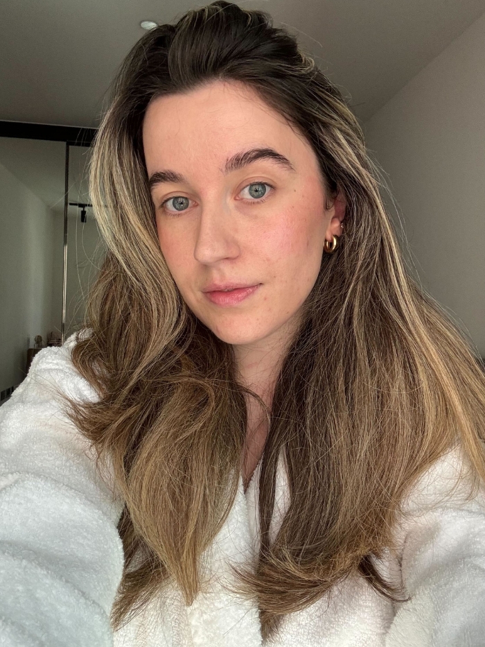 Deputy beauty editor Grace Lindsay taking a selfie with voluminous hair