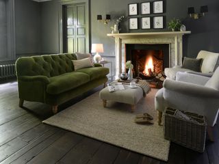 living room with sofa, armchairs and fireplace