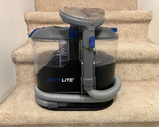 Kenmore Spotlite portable carpet spot and pet stain cleaner on carpeted stairs