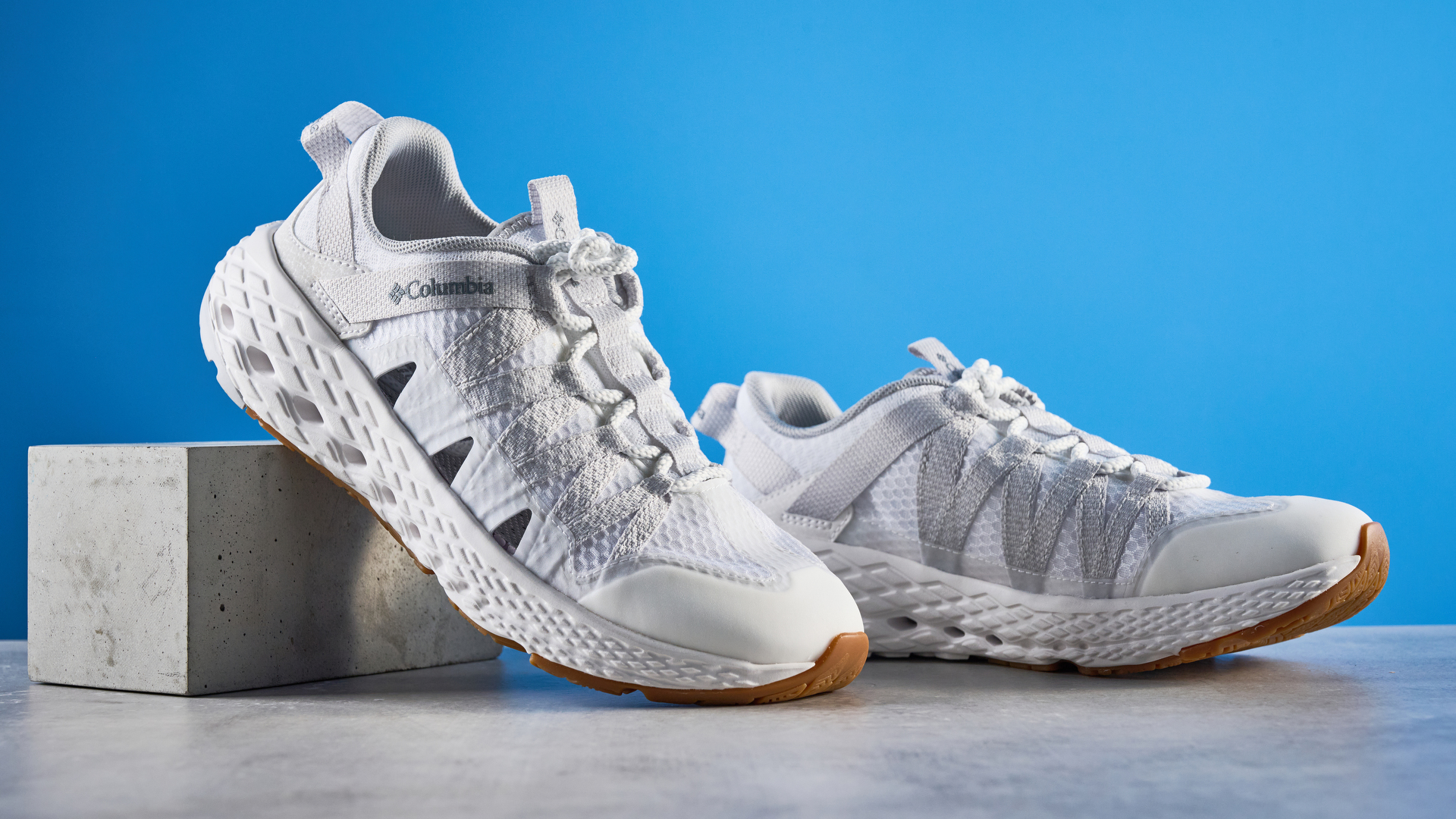 Columbia Drainmaker in white photographed in front of a blue background