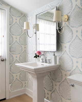 Small bathroom with blue and white wallpaper